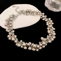Detailed macro shot of chunky silver cluster bead choker necklace with high-shine metallic finish - Silver