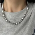 Close-up detail of an elegant grey pearl necklace with a sparkling heart-shaped clasp - Crushed Silver Gray Pearl Necklace (10#)