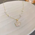 Elegant golden camellia flower pendant necklace with white pearls and sparkling rhinestones - Camellia Pearl Clavicle Chain (28#)