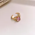 Detailed macro view of a gold stainless steel open ring with a round pink zircon - Wave Hollow Style (42#) / Gold-Pink