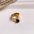 Detail view of hammered gold adjustable open ring featuring a square black gemstone - Ring #23 - Gold - Black