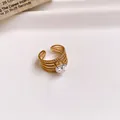 Detailed view of a gold-plated stainless steel hollow ring with a sparkling zircon - Ring #10 - Gold - Heart