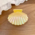 Detailed macro view of a pearlized iridescent shell hair claw clip with golden sheen - Small Shell Claw Clip / Small / Yellow