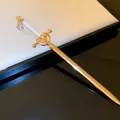 Elegant gold sword-shaped metal hairpin with white hilt for women - Gold Sword Shape (White Handle)