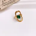 Elegant gold-plated stainless steel open ring featuring a vibrant oval green zircon stone - Ring #16 - Gold - Green