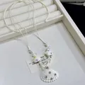 Close-up detail of shell pendant necklace with colorful rhinestones on white wax cord - Cute Shell Rhinestone Embellished Wax Rope Necklace / 12# Necklace-White