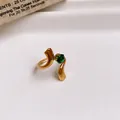 Elegant stainless steel open ring featuring a green zircon stone in gold finish - Ring #17 - Gold - Green
