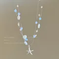 Charming multi-strand summer necklace featuring light blue beads and a silver starfish pendant - Ocean Starfish Style / Silver-Blue-Starfish