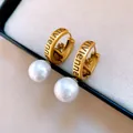 Elegant pearl hoop earrings featuring an engraved golden orb charm and white pearls - Cross Orb Pearl Hoop Earring (WE3908) / Gold