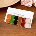 Detailed view of a 12-piece colorful enamel dripping oil stud earring set on card - Round Style (HE28358) / 12-Piece Set / Gold Multicolor