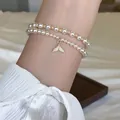 Élégant bracelet de perles à deux rangs avec un charmant pendentif queue de sirène en zircon - Or-Blanc