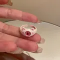 Close-up detail of a pink cat ear enamel ring featuring a unique monster eye design. - 7# Light Pink Cat Ear Eye Ring (AQ106)