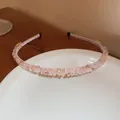 Elegant light pink crystal-encrusted headband featuring sparkling rhinestone accents - Pink