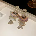 Macro view of vintage fan-shaped earrings featuring colorful zircon and gold plating - Earrings Only / Purple