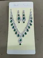 Elegant emerald green teardrop rhinestone necklace and earring set on card - Green Zirconia / Silver