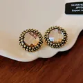 Vintage-style round flower stud earrings with faceted gemstone and beaded border - Gold