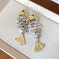 Elegant retro koi fish drop earrings featuring iridescent shell scales and blue eye - Koi Fish Style (HE27900) / White