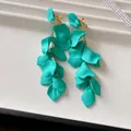 Detailed view of elegant teal green matte petal tassel long drop clip-on earrings - Clip-on Earrings / Green