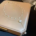 Elegante französische Vintage-Perlenhalskette mit weißem Rosenanhänger für Damen. - Y-Förmige Goldene Kamelien-Perlenkette