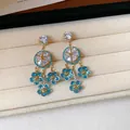 Orecchini pendenti a fiore blu vintage con cristalli scintillanti e finitura oro - 47# Perno in argento - Oro - Blu