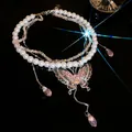 Luxurious multi-layer pearl necklace featuring a pink butterfly pendant with crystals - Silver-Pink-White