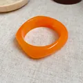 Vintage orange marbled resin square spiral bangle with a unique geometric fashion design - Orange