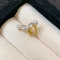 Detailed close-up of a gold ear cuff featuring sparkling zircons and elegant white pearls - Non-Piercing (Single) / Gold