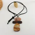 Macro view showing the texture and marbled finish of the three-tier resin pendant pieces. - Necklace-Black (HN7745) / Dark Coffee