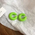 Minimalist green spray-painted C-shaped resin hoop earrings on white paper background - 56# Neon Green