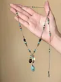 Bohemian beaded necklace with turquoise stones and gold coin charm detail - Style 58 Necklace / Blue