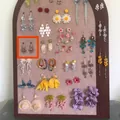 Detailed display of vintage bohemian floral and tassel dangle earrings on felt board - 3#