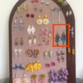 Detailed view of bohemian forest style blue beaded tassel dangle earrings on a display board - 6# Ear Hook
