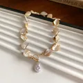 Bohemian irregular shell beaded necklace with gold OT buckle and pearl pendant. - Style 23 Necklace / Gold and Shell