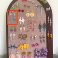 Detailed view of elegant blue beaded tassel earrings displayed on a jewelry board - 12#