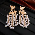 Detailed macro shot of vintage gold leaf earrings featuring elegant cascading pearl tassels - Maple Leaf Pearl Tassel Style (5#) / White