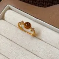 Macro view of a gold plated tiger eye open ring with shimmering star accents in a box. - 3# Ring-Gold-Brown (Real Gold Plated)-Star Accent