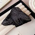Close-up of a black satin triangular hair claw clip decorated with sparkling rhinestones. - Style 2-Dense Rhinestone / Black
