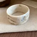Detailed view of a wide marble resin bangle featuring elegant natural ink patterns - Gray