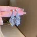 Elegant sparkling silver zirconia feather drop earrings with teardrop center stone. - 26# Silver Earring Post-Silver