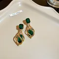 Elegant gold twisted cage drop earrings featuring brilliant emerald green stones - Spiral Vintage Style (2#) / Gold