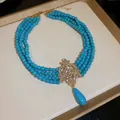 Bohemian multi-layer turquoise bead necklace with vintage gold crystal pendant - Blue