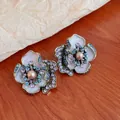 Elegant vintage flower stud earrings with colorful rhinestones and central pearl detail - Flower Earrings with Silver Post Style
