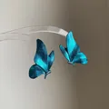 Detailed view of elegant blue spray-painted butterfly earrings with sparkling rhinestones - Silver Needle Style (53#)