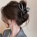 Elegant large metallic bow-shaped shark hair claw clip with a black pearl accent. - Metallic Bow Bead Style / Gunmetal