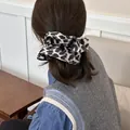 Vintage leopard print scrunchie hair accessory for women with a chic and retro aesthetic design - Leopard Scrunchie / Gray