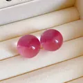 Elegant pink cat-eye sphere stud earrings with silver needles presented in jewelry box. - Cat-Eye Translucent Sphere (30#) / Silver Earring Post Style / Peach Pink