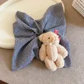 Large gingham scrunchie featuring a cute plush bear ornament with a red bow. - Plush Bear Scrunchie / Black