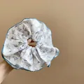 Vintage style white fabric scrunchie with purple floral print and elegant blue ruffled edge - Floral Rabbit Scrunchie / White