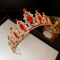 Macro view of a vintage gold crown with red teardrop crystals and sparkling rhinestones - 15# Headband - Red Rhinestone Flower Waterdrop Crown