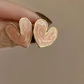 Macro view of elegant heart-shaped earrings with pink enamel finish and gold edges - 4# Silver Needle - Pink